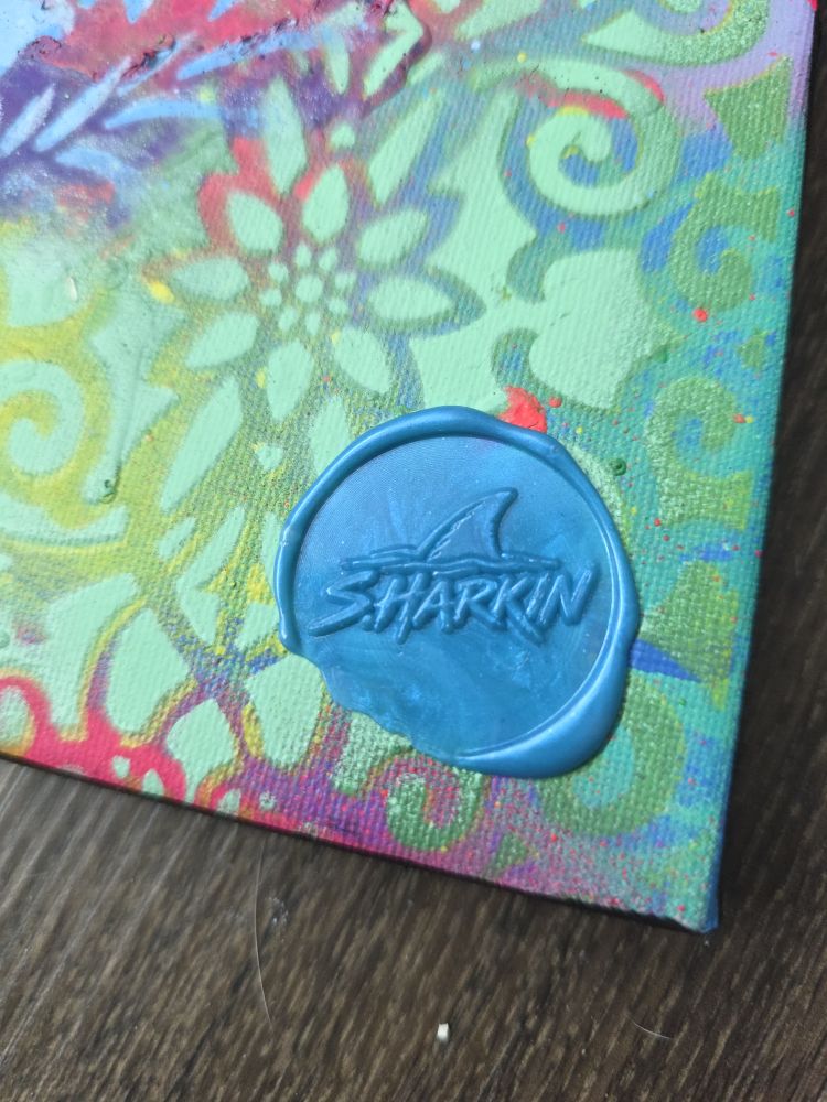Close-up of the blue wax SHARKIN seal on Butterfly Reef