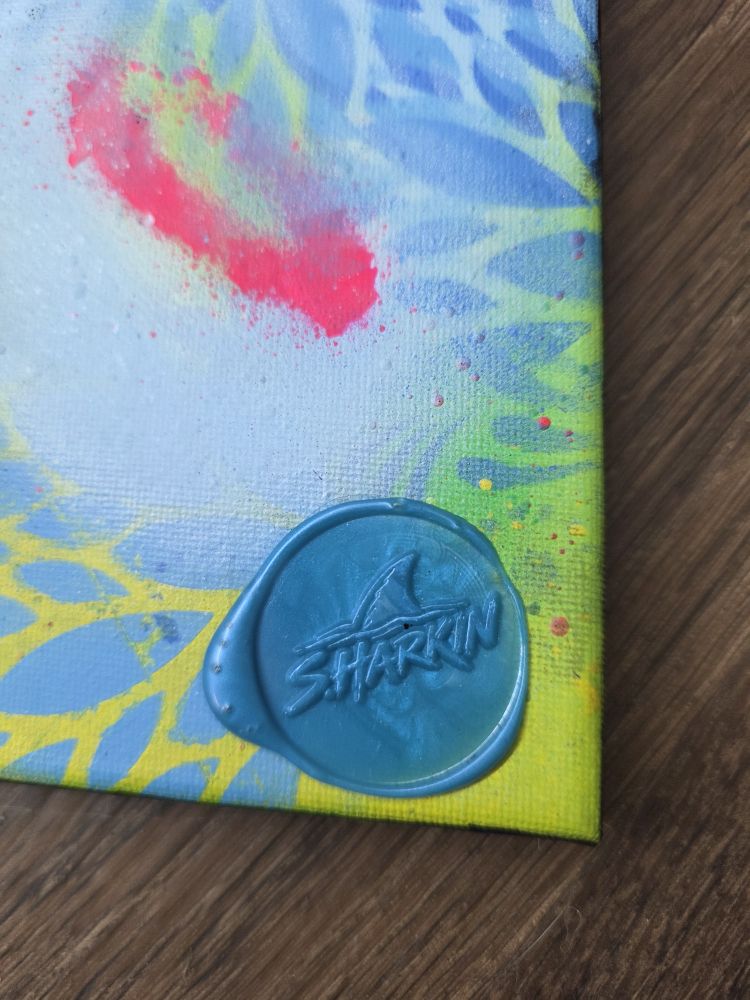Close-up of the blue wax SHARKIN seal on Neon Current