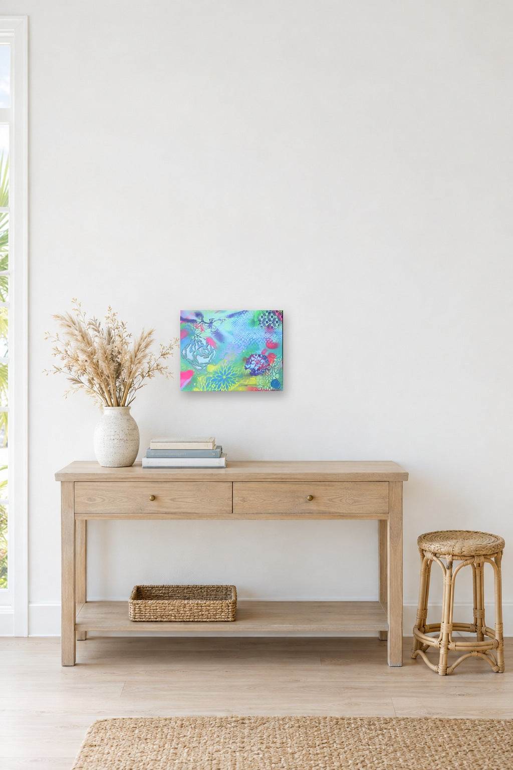Sample room view: Butterfly Reef above a console in an AI-generated coastal room (room is a digital mockup)